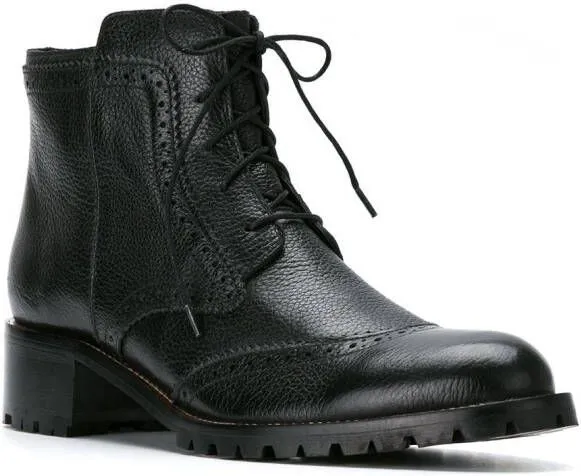 Black combat boots by Sarah Chofakian